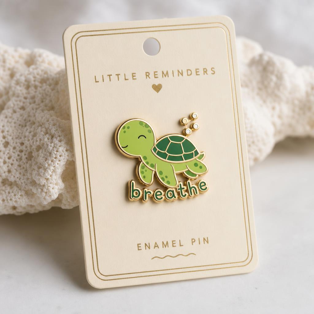 Tommy Turtle breathe hard enamel pin on a cream backing card